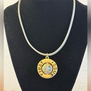 VTG G/T pendant featuring spinning globe w/text “First Issue” on outer ring